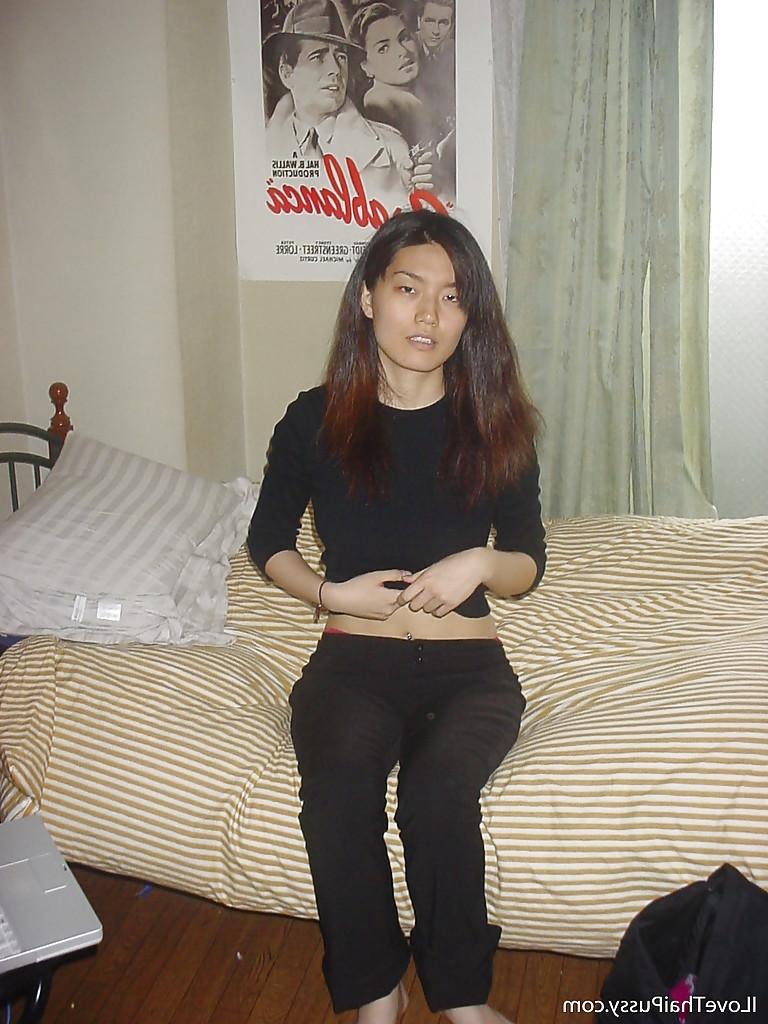 16P Seductive asian babe slipping off her clothes and showing off her big tits