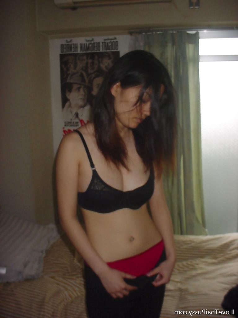 16P Seductive asian babe slipping off her clothes and showing off her big tits