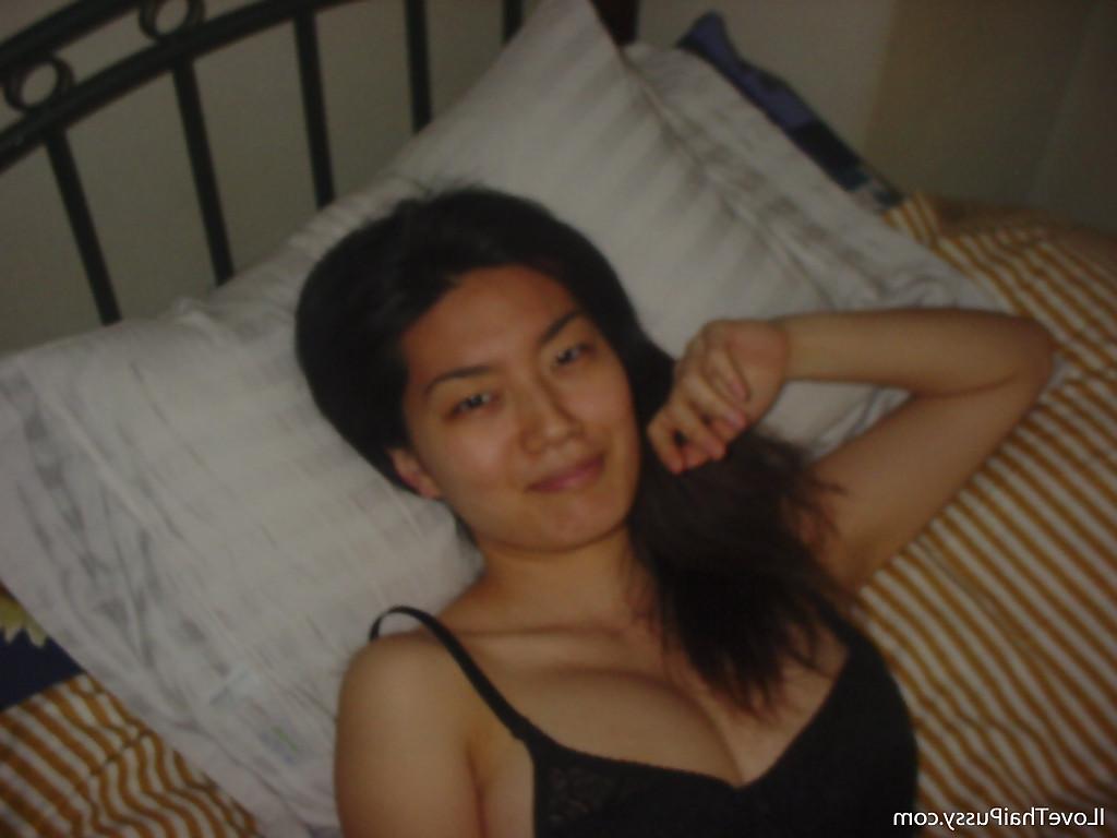 16P Seductive asian babe slipping off her clothes and showing off her big tits