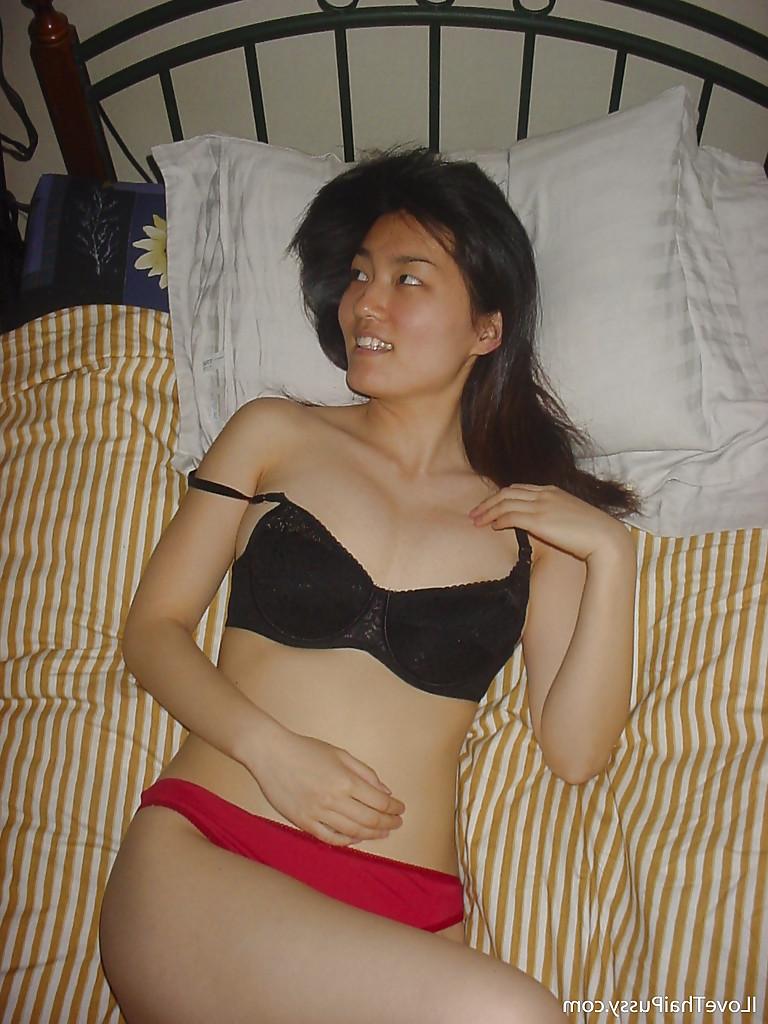 16P Seductive asian babe slipping off her clothes and showing off her big tits