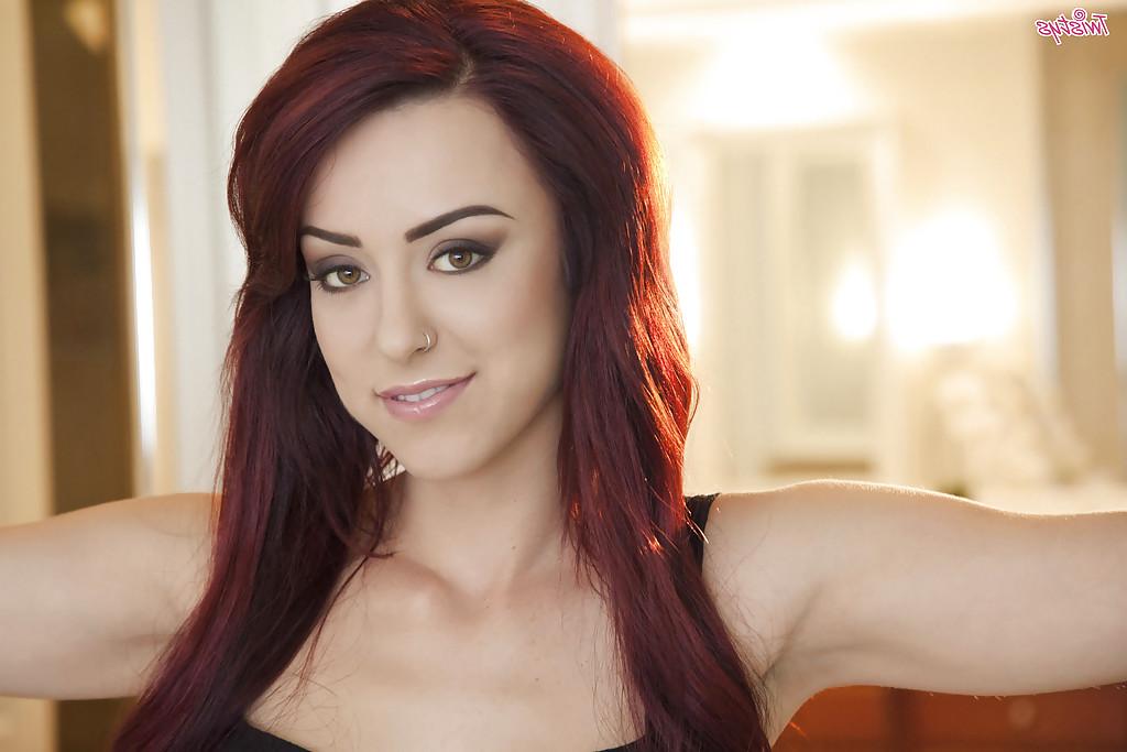 16P Strict pornstar babe Amber Rouge lies on table and touches her twat