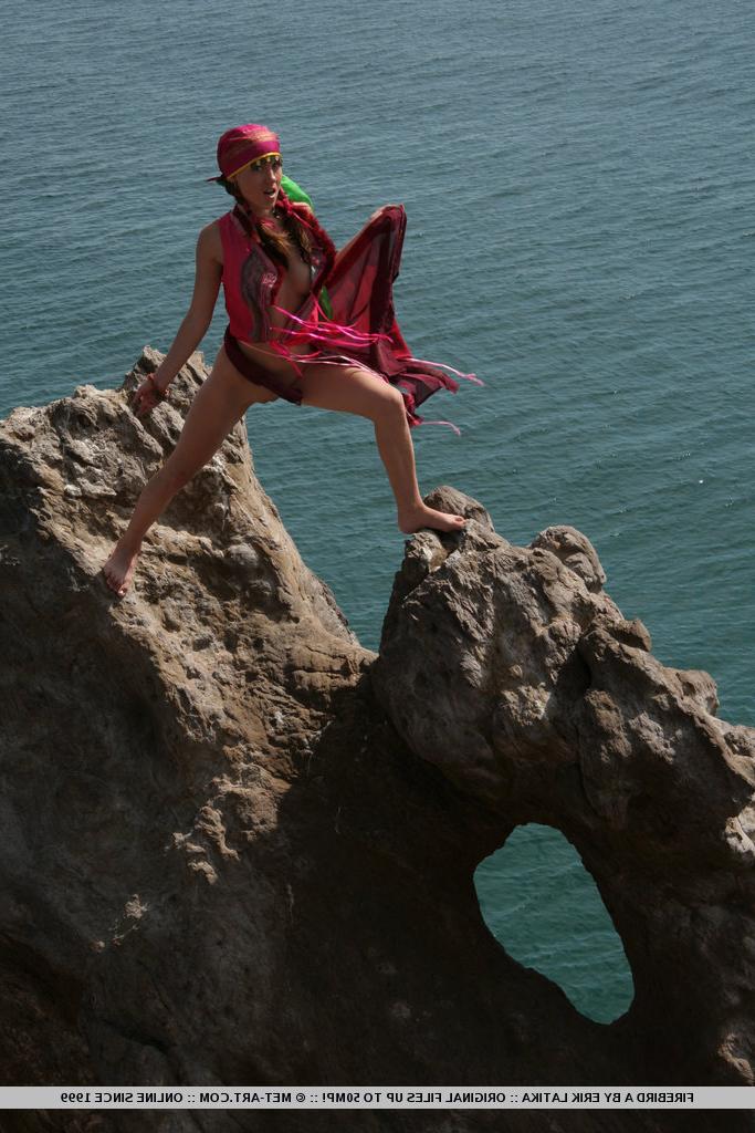18P European teen Firebird A posing barefoot on rocky cliffs in revealing outfit