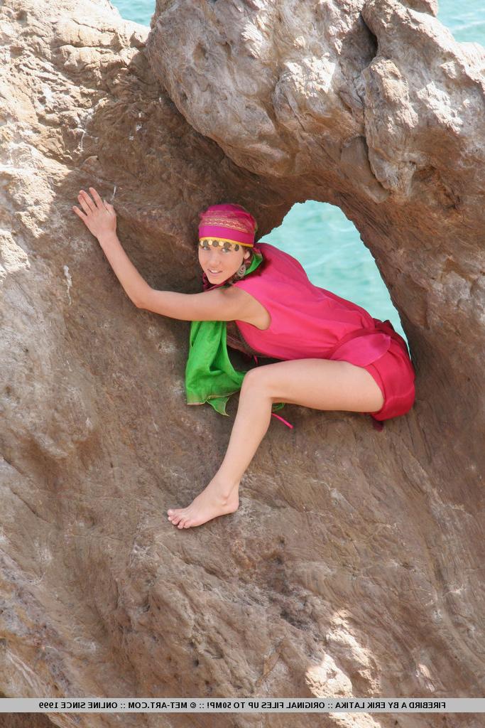18P European teen Firebird A posing barefoot on rocky cliffs in revealing outfit