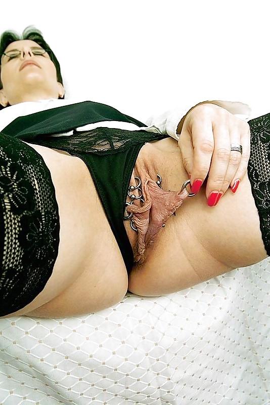 9P Mature slut showing off extreme piercings