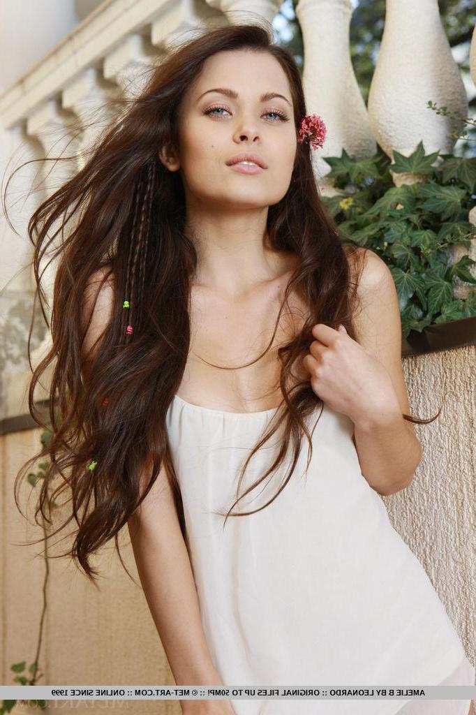 18P Brunette beauty Amelie B strips naked and flaunts her sexy long legs
