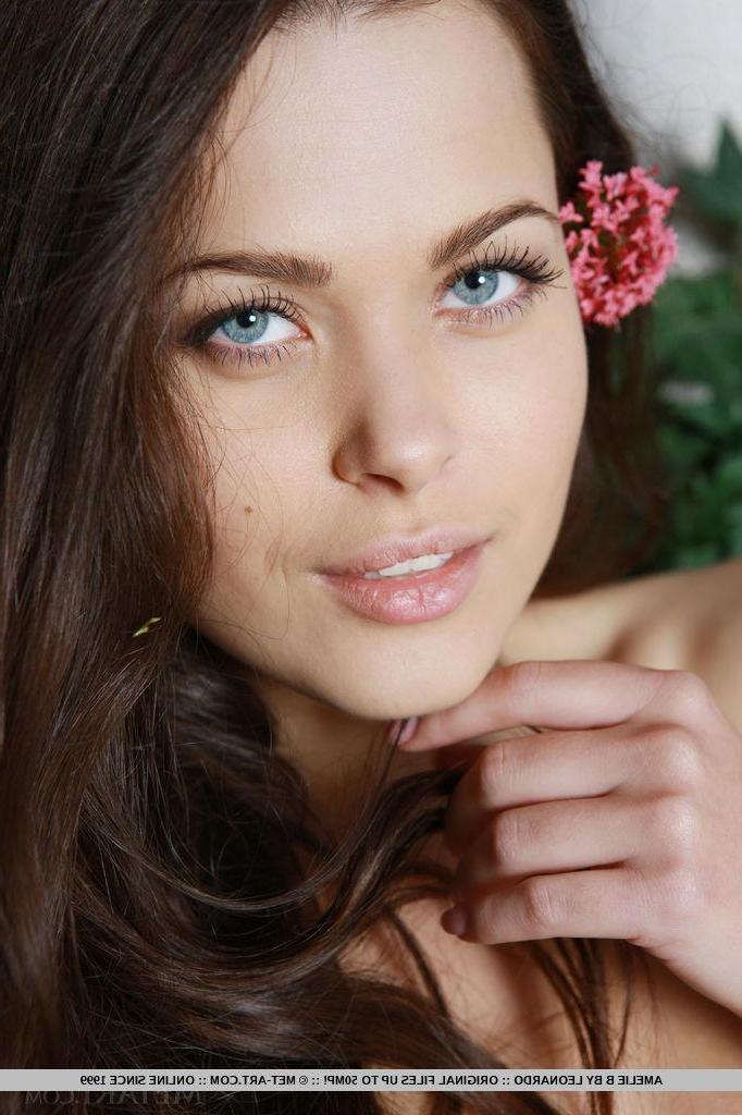 18P Brunette beauty Amelie B strips naked and flaunts her sexy long legs