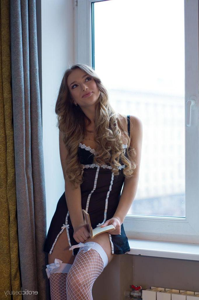 16P Beautiful blonde teen Amy Moore gets inspired to strip while reading a good book