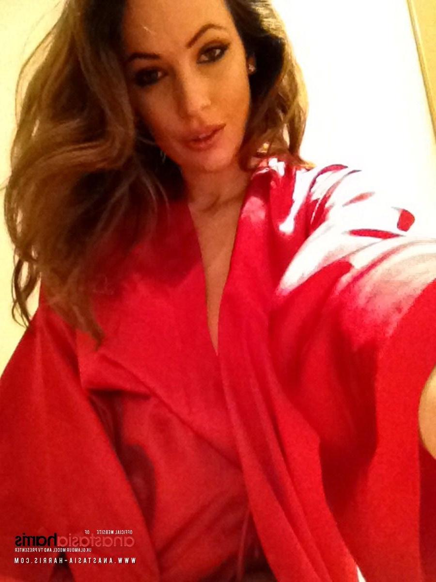 12P Anastasia Harris stripping her hot red top, this sexy self shot photoset found inside my website