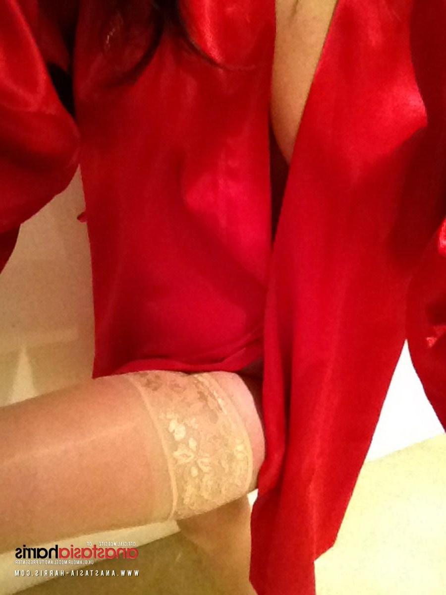 12P Anastasia Harris stripping her hot red top, this sexy self shot photoset found inside my website
