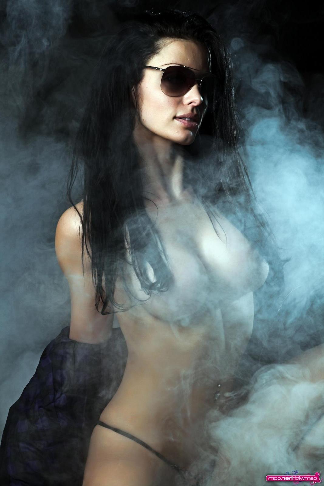12P Busty babe Angelina Stevens poses behind a curtain of smoke