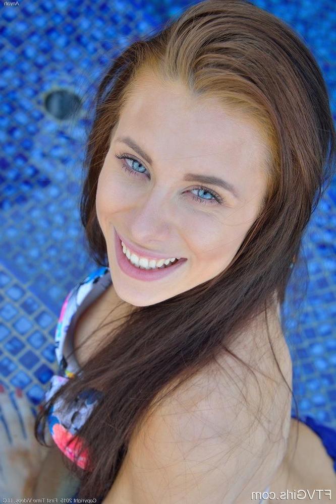 15P Pretty girl Anyah strips and masturbates in the swimming pool
