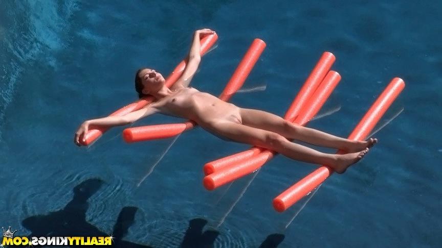 20P Hot redheads Elle and Ashley enjoy the taste of pussy by the pool