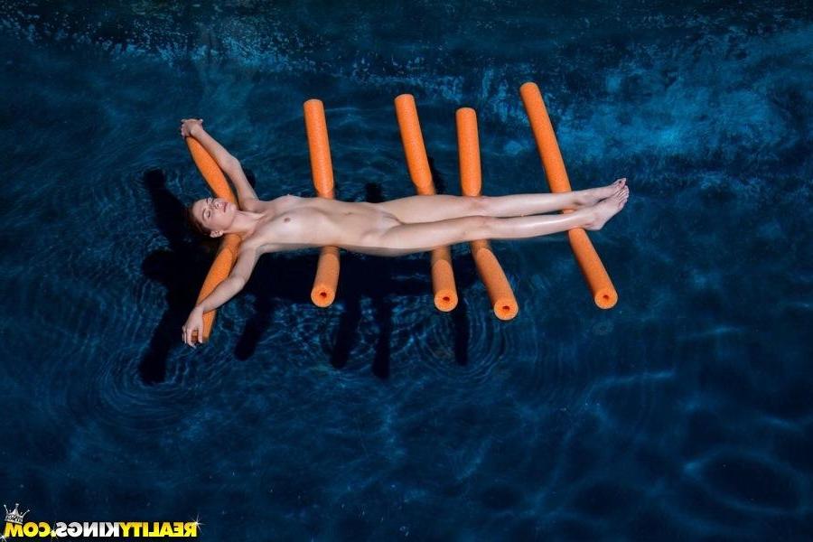 20P Hot redheads Elle and Ashley enjoy the taste of pussy by the pool