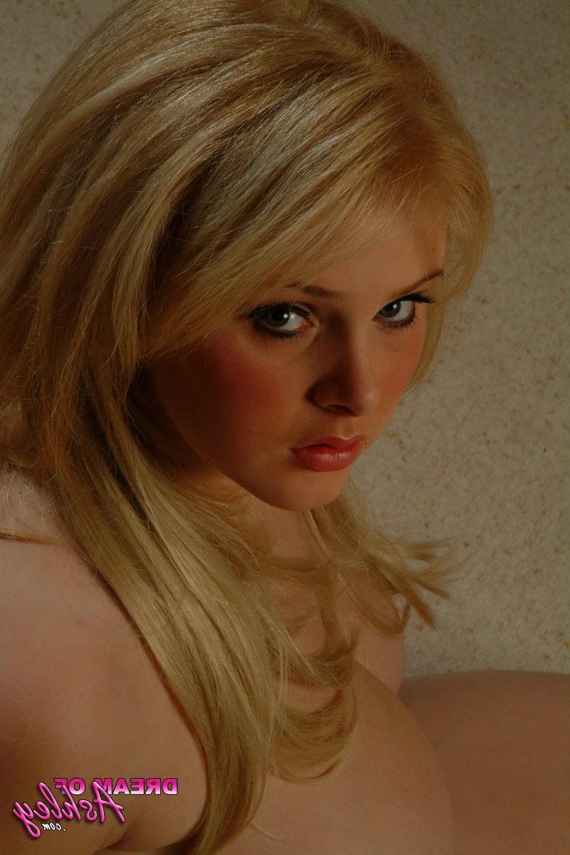 16P Ashley plays with her big natural boobs as she strips out of her pink corset