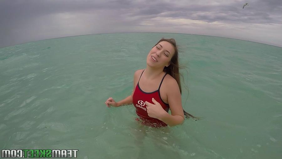 16P Teen babe Kimber Lee flashing large natural tits in the ocean