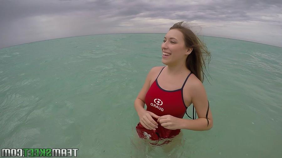 16P Teen babe Kimber Lee flashing large natural tits in the ocean