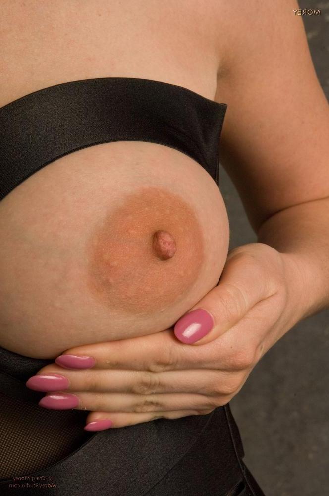 11P Busty model Heather Gates shows her big boobs in the studio