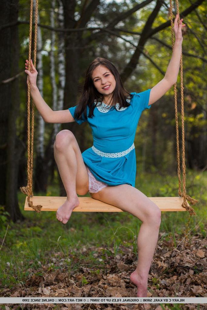 18P Brunette coed Hilary C gets naked on a swing in "Porrea"