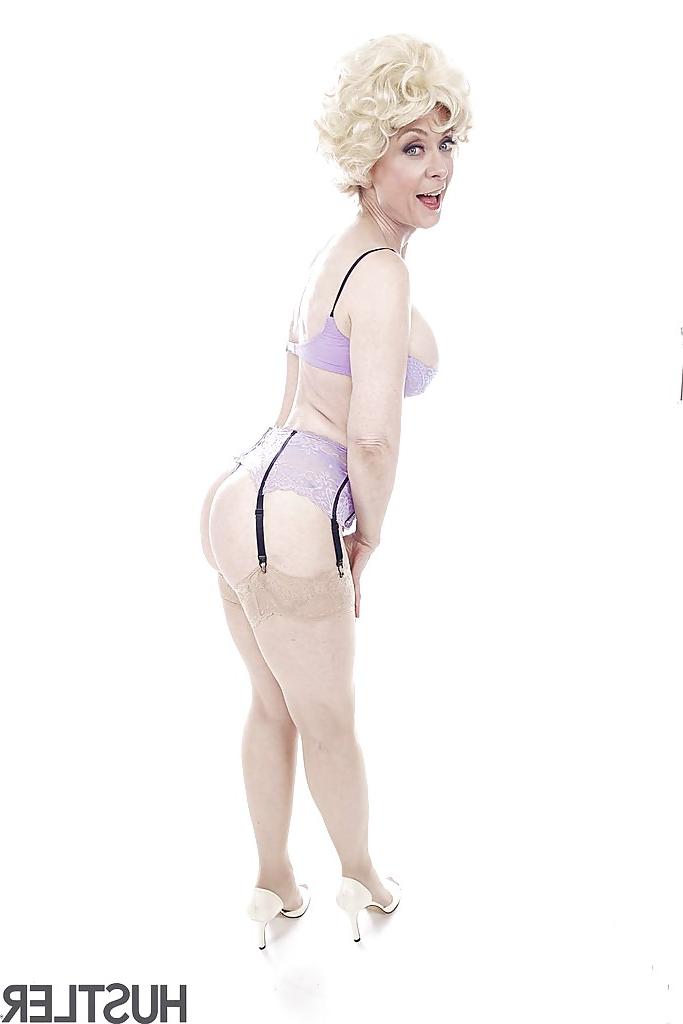 16P Experienced pornstar Nina Hartley posing topless in sexy lingerie