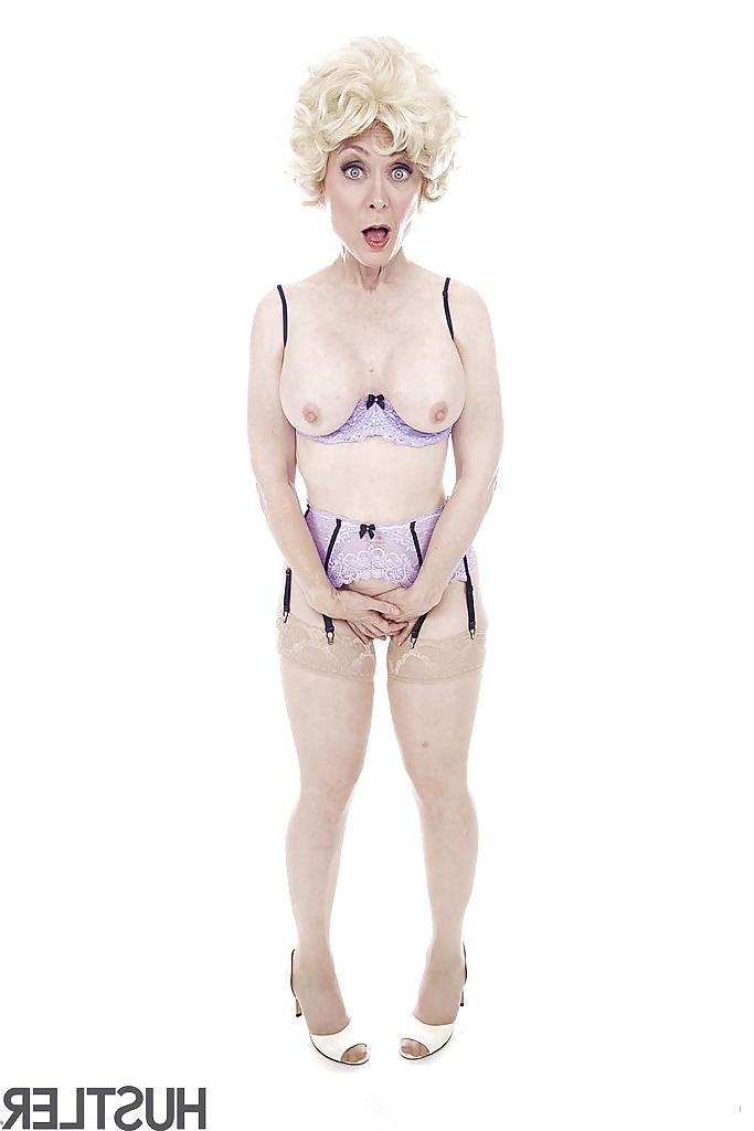 16P Experienced pornstar Nina Hartley posing topless in sexy lingerie