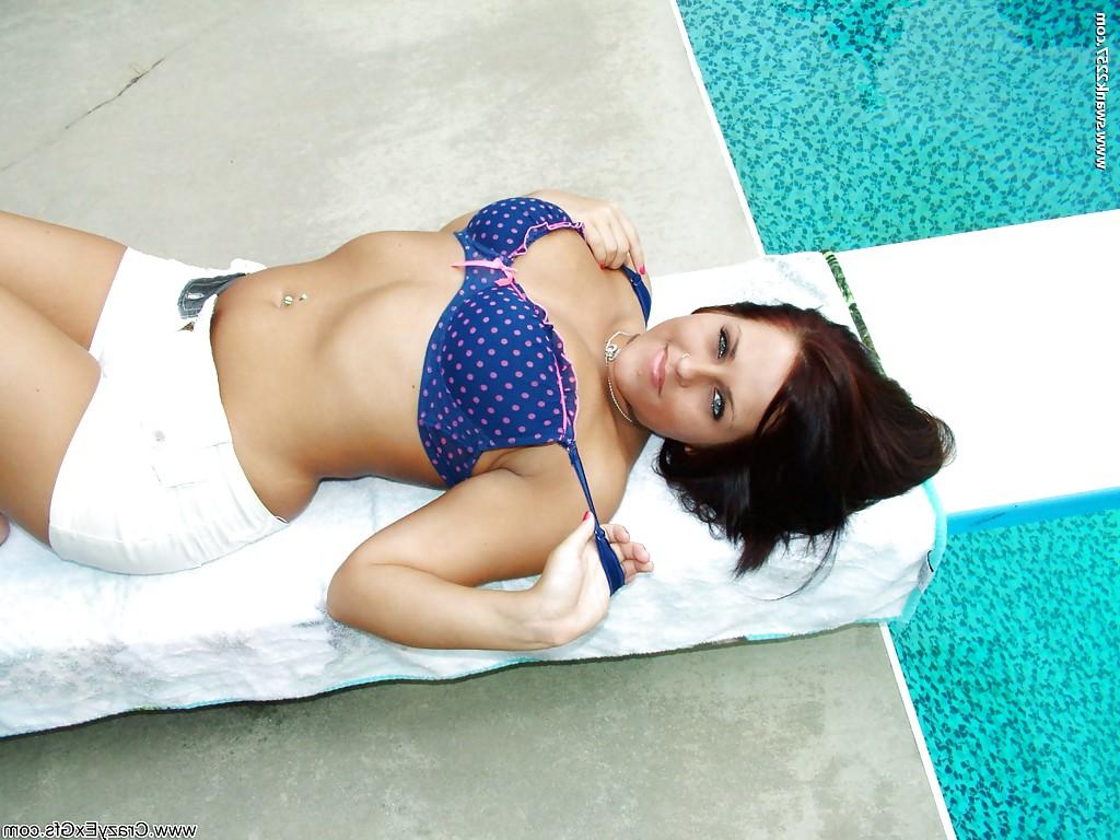 16P Chubby brunette babe revealing her ample breasts at the poolside