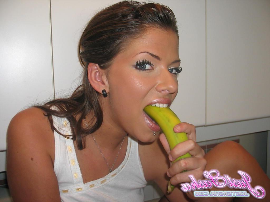20P Pictures of teen babe Just Sasha putting something long and stiff in her mouth