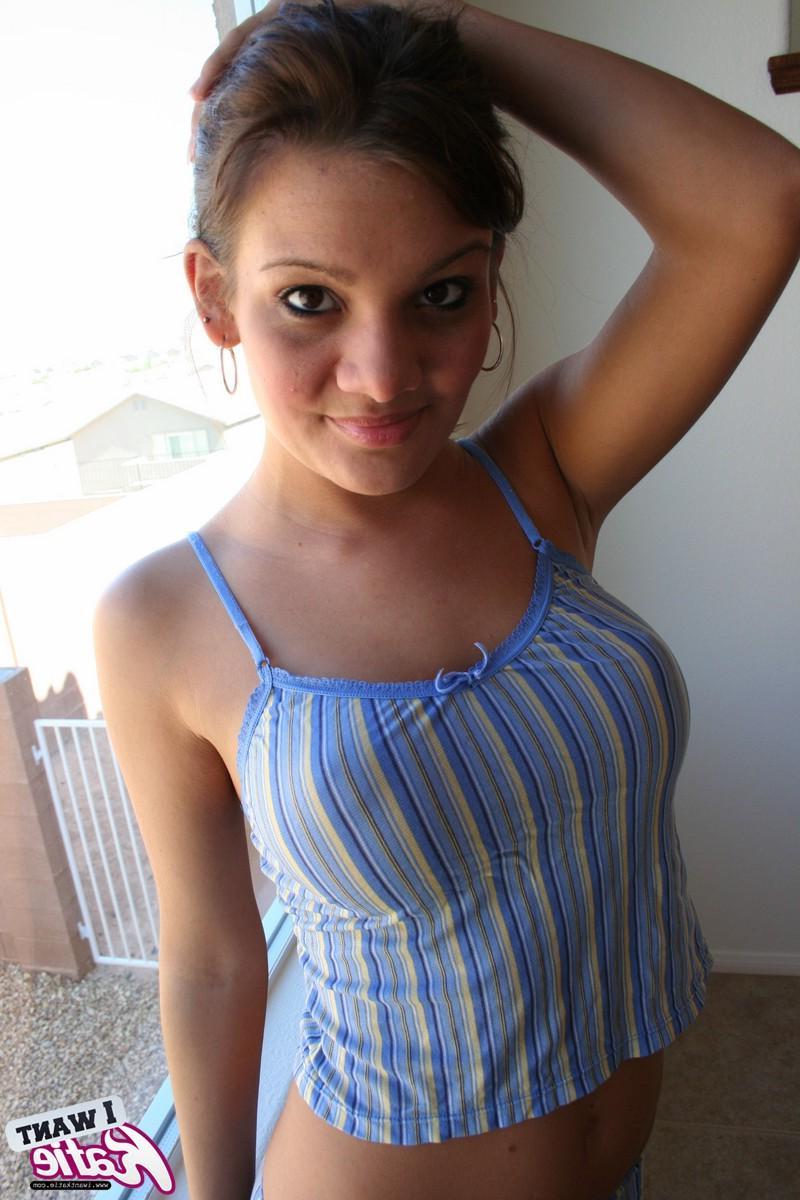 12P Watch as Katie strips out of her striped covered lingerie by the window for all to see
