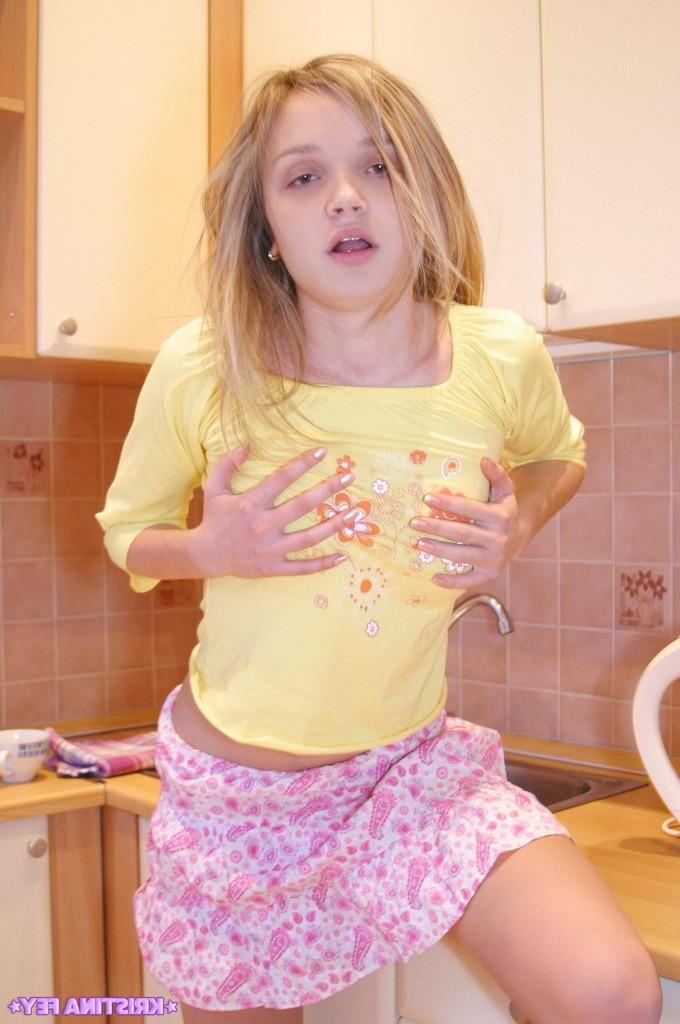 15P Pictures of Kristina Fey exposing her small teen tits and natural bush