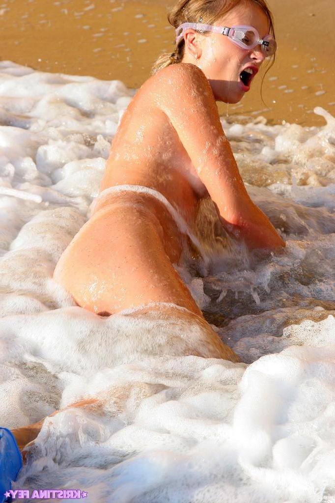 15P Pictures of Kristina Fey swimming naked on a beach