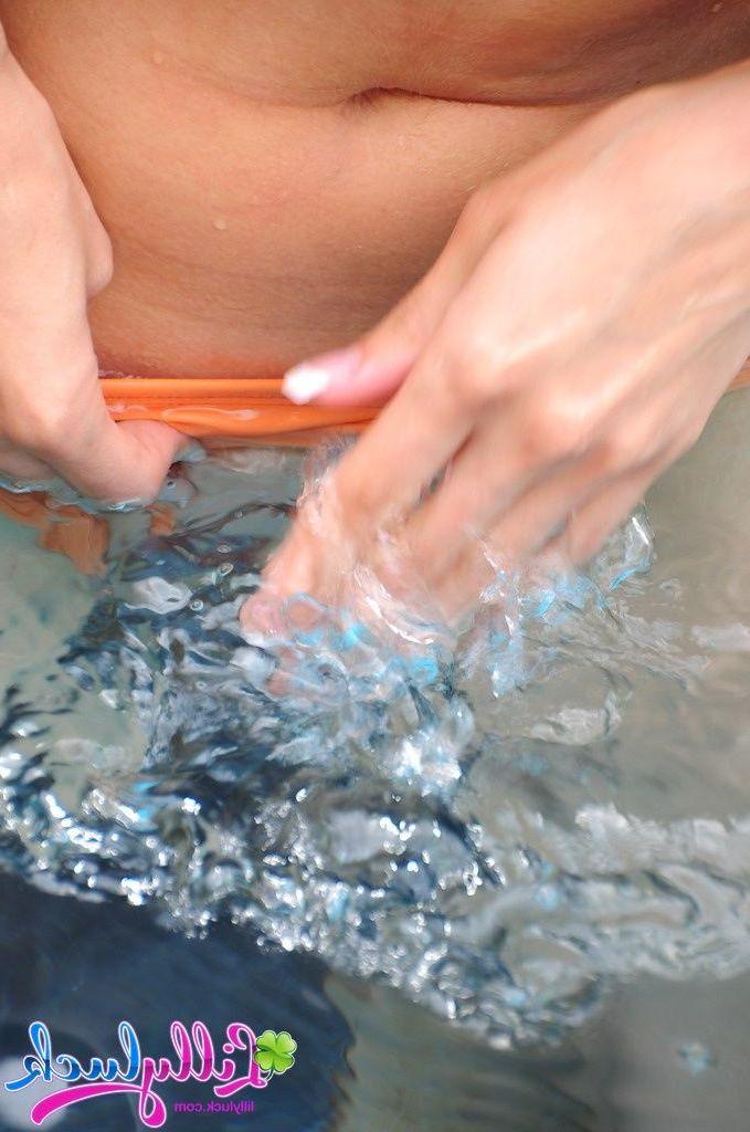 20P Pictures of teen cutie Lilly Luck getting naked in the pool