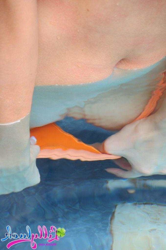 20P Pictures of teen cutie Lilly Luck getting naked in the pool