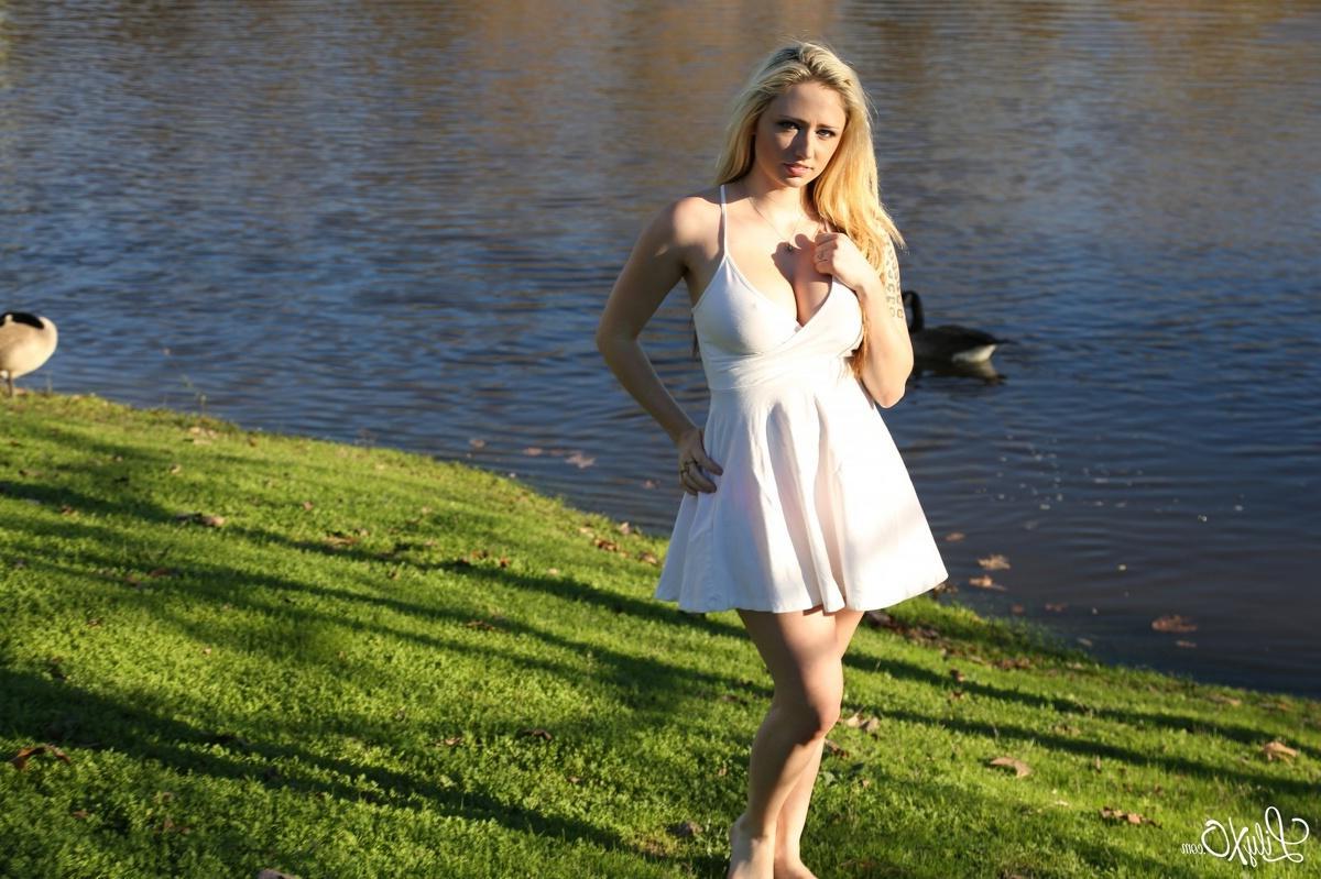 15P Lily Xo poses and shows her pink panties on the rocks