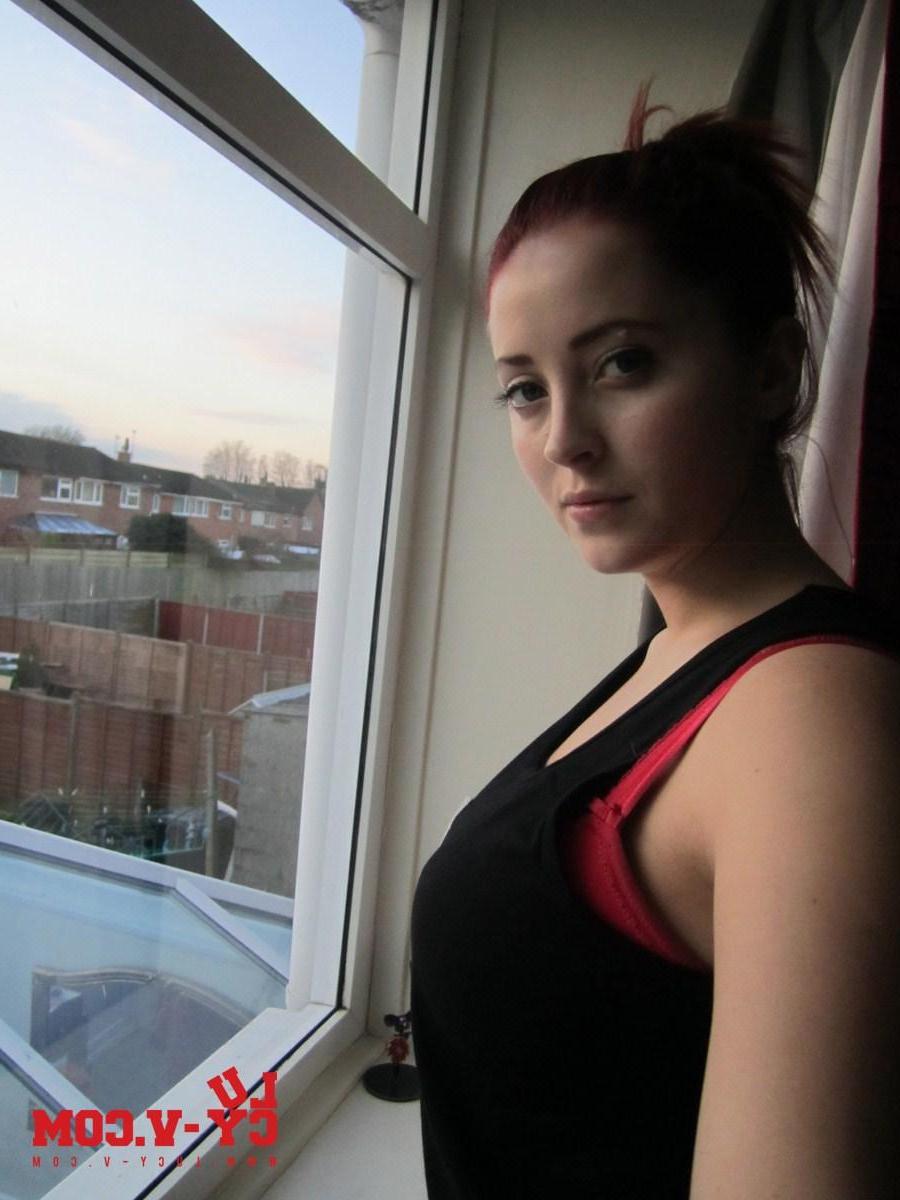 12P Lucy V strips at home, in front of the window, this sexy self shot photoset found inside my website