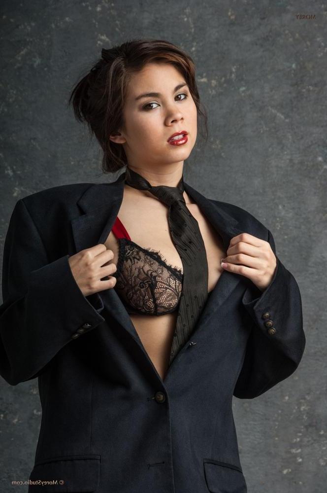 12P Mai Ly strips out of her business suit to reveal her big natural boobs and wet pussy