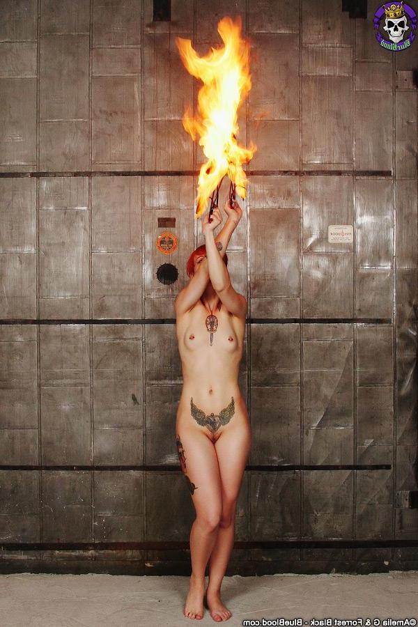 15P Redhead fire dancer Pandora Von Kit heats things up