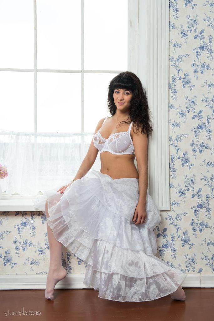 16P Busty brunette Alie A poses in her white skirt and stockings