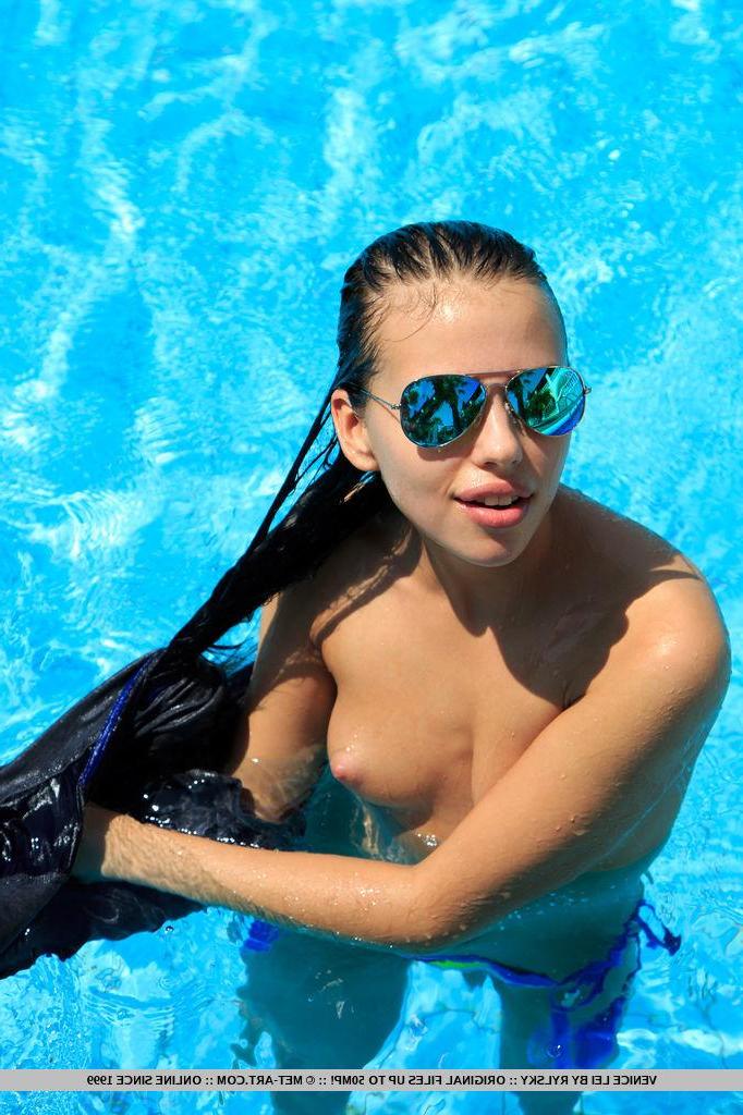 18P Venice Lei dips on the pool as she bares her unshaven pussy