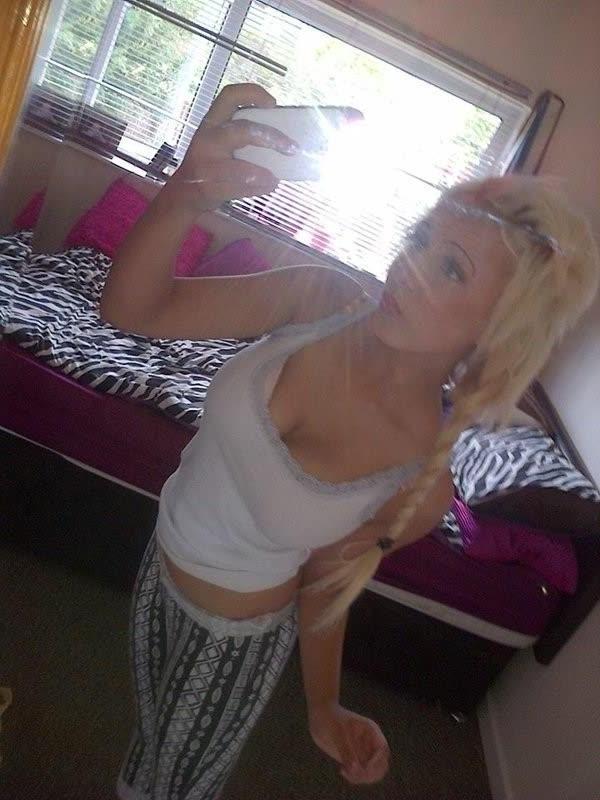 10P Chick flaunts her big round tits while posing in tight tops