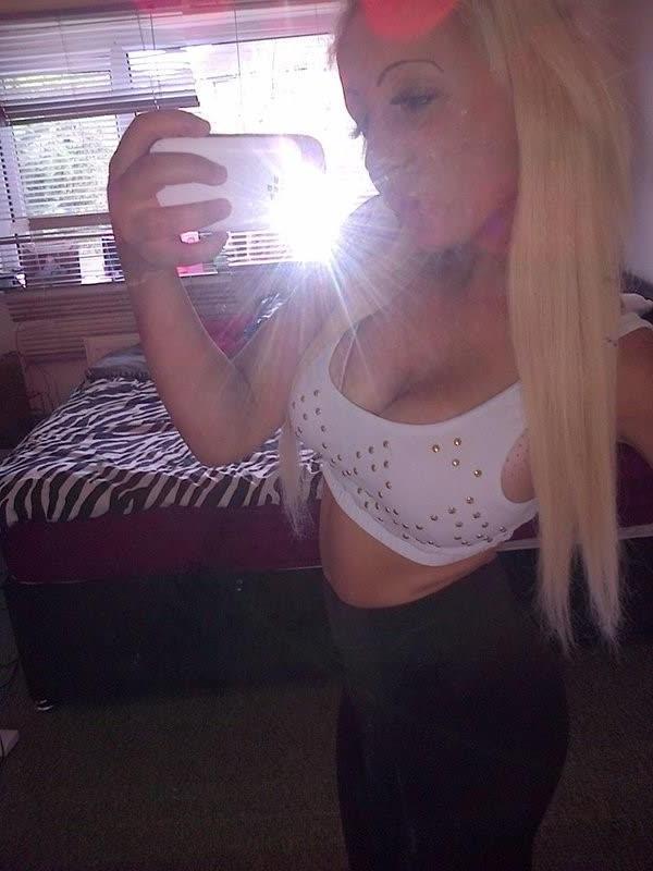 10P Chick flaunts her big round tits while posing in tight tops