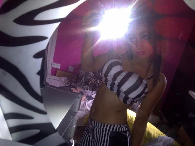 10P Chick flaunts her big round tits while posing in tight tops