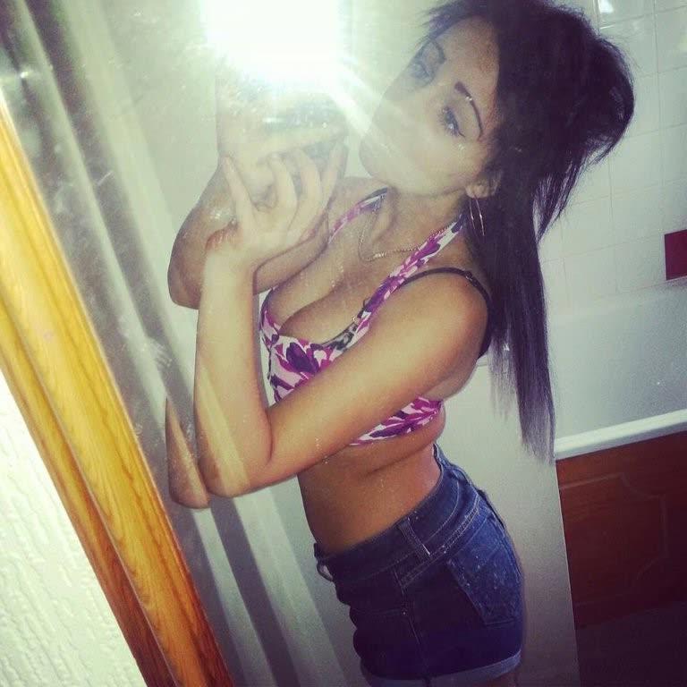10P Chick flaunts her big round tits while posing in tight tops