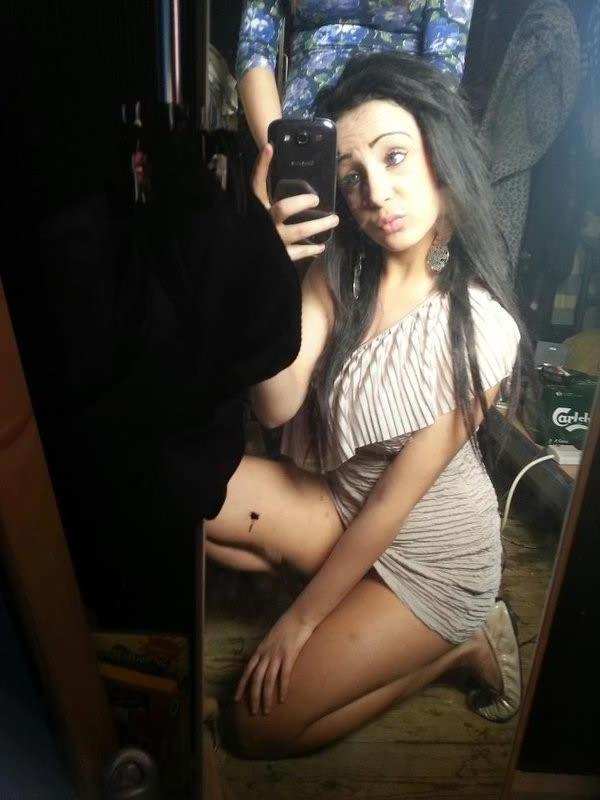 10P Chick flaunts her big round tits while posing in tight tops