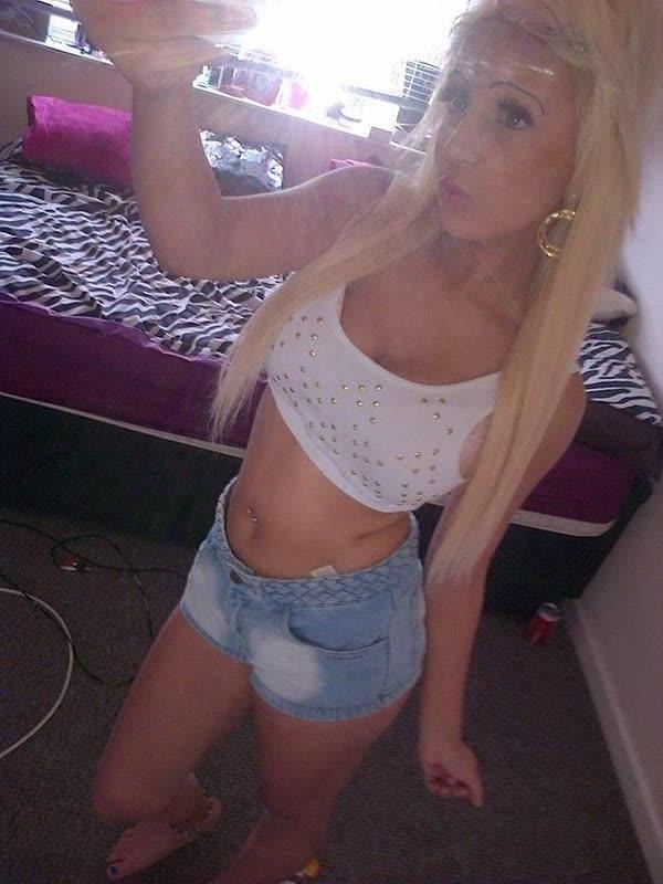 10P Chick flaunts her big round tits while posing in tight tops
