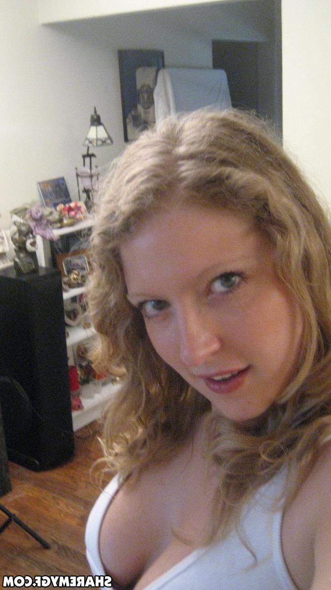 12P Busty blonde girlfriend shows off her huge tits as she takes selfshot mirror pictures
