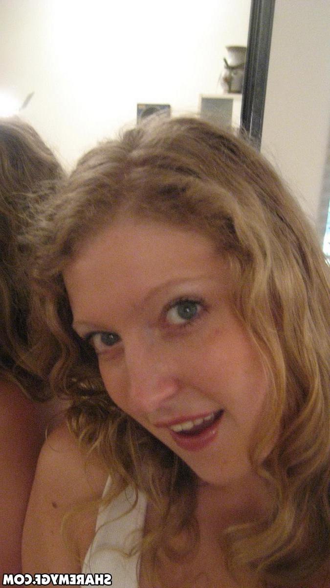 12P Busty blonde girlfriend shows off her huge tits as she takes selfshot mirror pictures