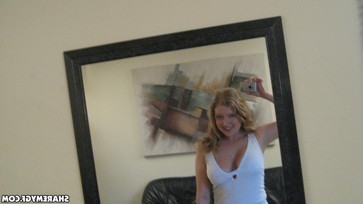 12P Busty blonde girlfriend shows off her huge tits as she takes selfshot mirror pictures