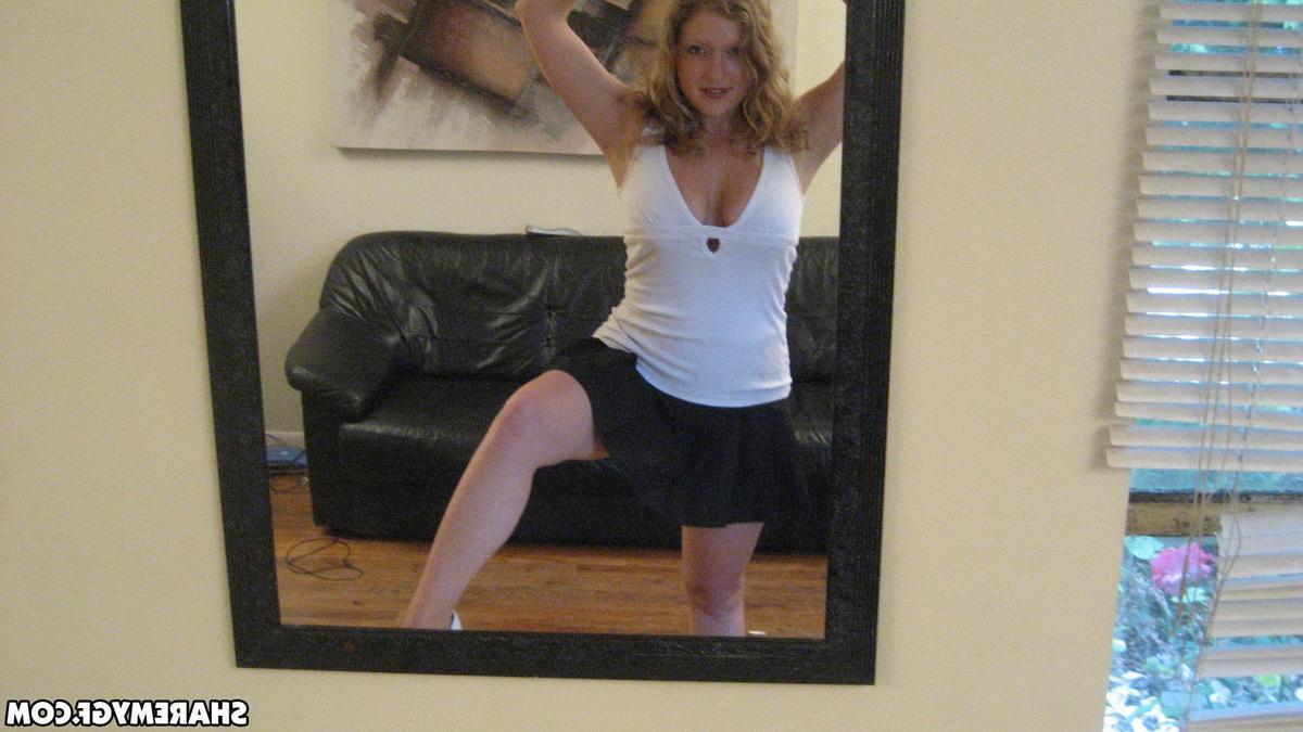12P Busty blonde girlfriend shows off her huge tits as she takes selfshot mirror pictures