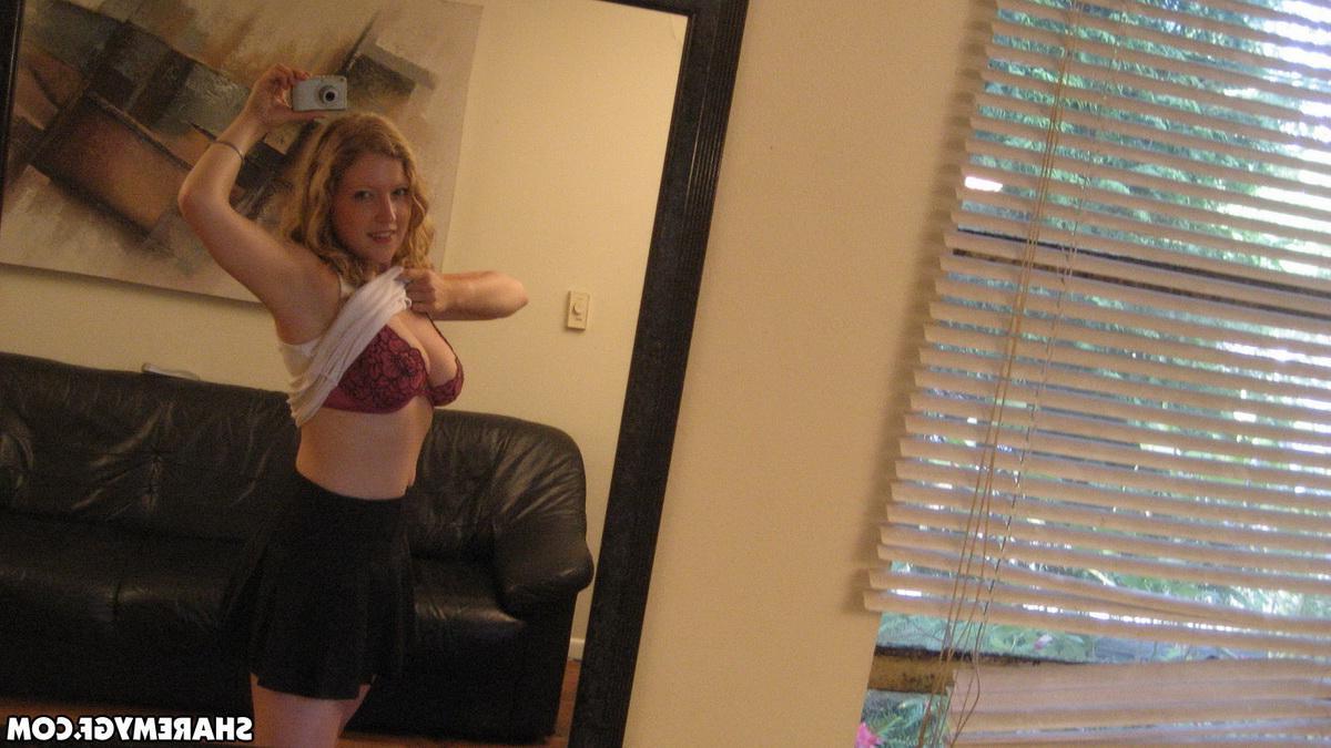 12P Busty blonde girlfriend shows off her huge tits as she takes selfshot mirror pictures
