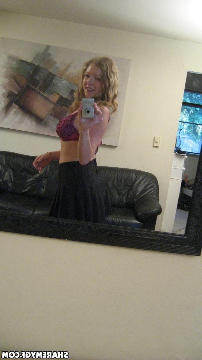 12P Busty blonde girlfriend shows off her huge tits as she takes selfshot mirror pictures