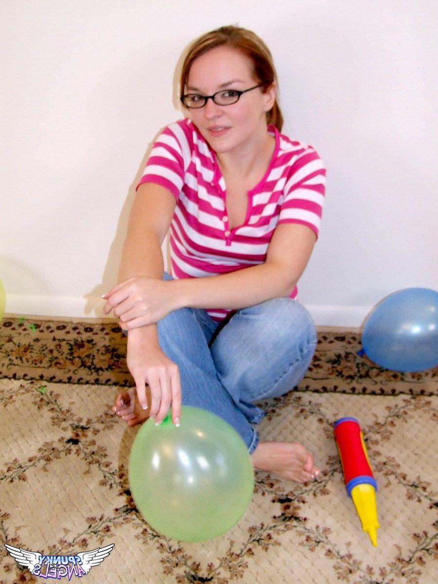 20P Pictures of a cute teen in glasses and balloons